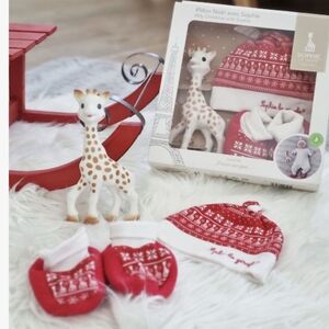 Sophie la girafe, a Christmas hat, and matching baby slippers New In Box
